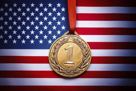 Gold medal on the background of the flag of the United States of Americaの写真素材