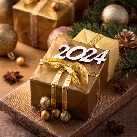 Christmas gifts. 2024. Christmas or New Year's Sale design template. Gift boxes under a Christmas...
