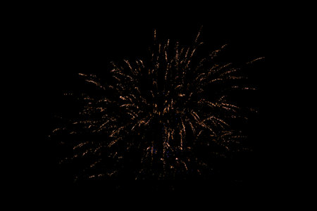 Fireworks. Colorful celebration fireworks isolated on a black sky background. From below, shot of...