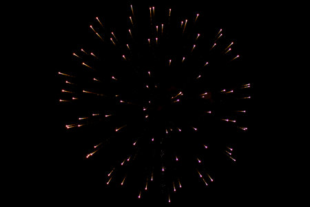 Fireworks. Colorful celebration fireworks isolated on a black sky background. From below, shot of...