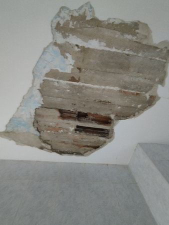 Works. Renovation. House under construction. Time to paint the walls. Installing the new floor. Holes in the ceilings and walls.の写真素材