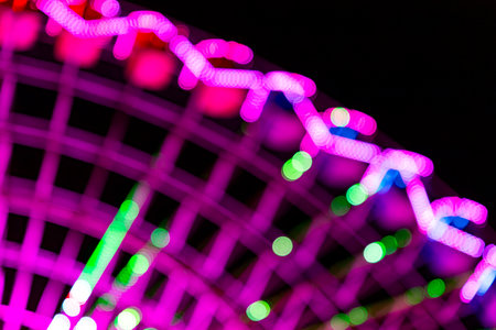 Ferris wheel. Noria. Christmas lights in Vigo, Pontevedra. Christmas decorations. Tourists strolling through its streets. Ferris wheel in the dark showing neon colors. VIGO. SPAIN.の写真素材