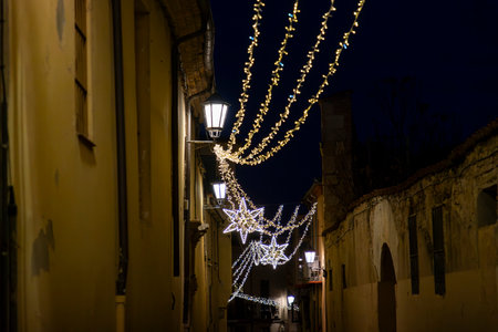 Christmas. Lights. Christmas lights through the streets of Zamora. Decorating streets of the city. Fir tree with Christmas lights. Christmas ball. On. ZAMORA. SPAIN. 29 December 20の写真素材