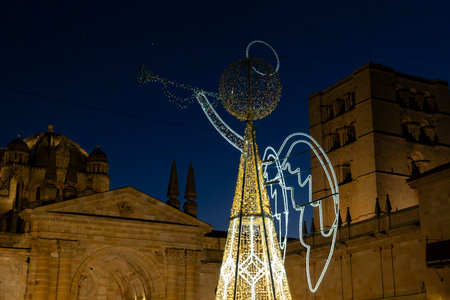 Christmas. Lights. Christmas lights through the streets of Zamora. Decorating streets of the city. Fir tree with Christmas lights. Christmas ball. On. ZAMORA. SPAIN. 29 December 20の写真素材