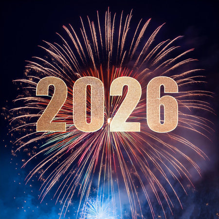 Happy new year 2016 written with Sparkle fireworks over night sky backgroundの写真素材