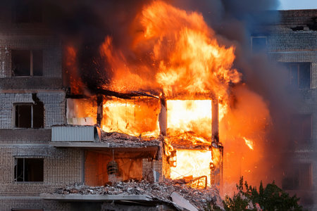 Israel and Iran clash in a conflict affecting civilians in Tel Aviv and Herzliya, with destroyed buildingsの写真素材