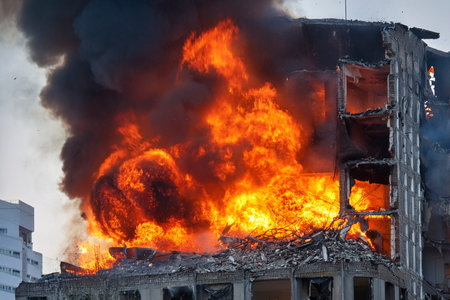 Israel and Iran clash in a conflict affecting civilians in Tel Aviv and Herzliya, with destroyed buildingsの写真素材