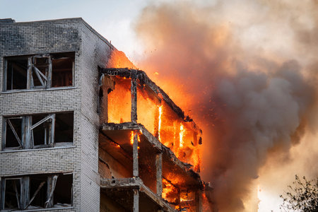 Israel and Iran clash in a conflict affecting civilians in Tel Aviv and Herzliya, with destroyed buildingsの写真素材