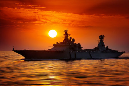 Aircraft carrier on sea near Iraq over sunset. Conflict in the Middle East. War between Iran and Israel with the participation of countries such as the United States and Russia.の写真素材