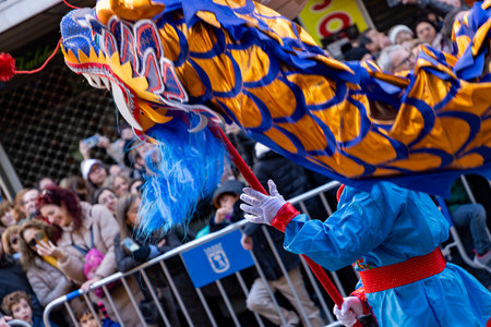 Chinese citizens celebrating Lunar New Year in the streets during public festivities marking the Year of the Horse in 2026. Cultural tradition and community event.のeditorial素材