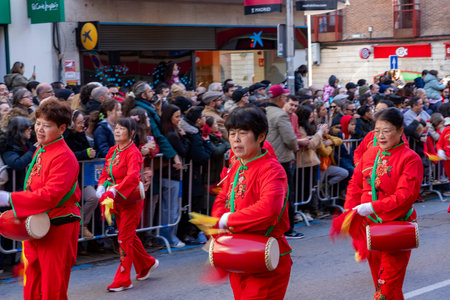 Chinese citizens celebrating Lunar New Year in the streets during public festivities marking the...