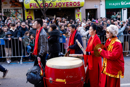 Chinese citizens celebrating Lunar New Year in the streets during public festivities marking the...