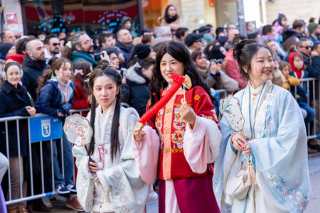 Chinese citizens celebrating Lunar New Year in the streets during public festivities marking the Year of the Horse in 2026. Cultural tradition and community event.のeditorial素材