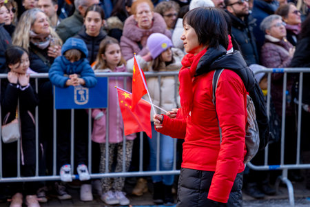 Chinese citizens celebrating Lunar New Year in the streets during public festivities marking the...