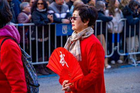 Chinese citizens celebrating Lunar New Year in the streets during public festivities marking the Year of the Horse in 2026. Cultural tradition and community event.のeditorial素材