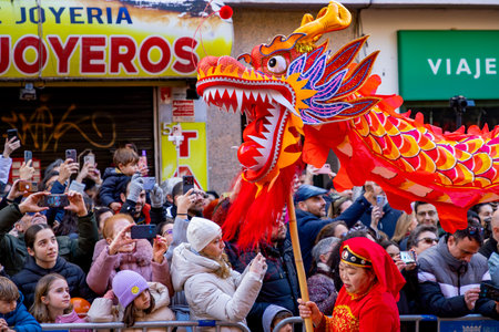 Chinese citizens celebrating Lunar New Year in the streets during public festivities marking the...