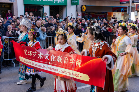 Chinese citizens celebrating Lunar New Year in the streets during public festivities marking the Year of the Horse in 2026. Cultural tradition and community event.のeditorial素材