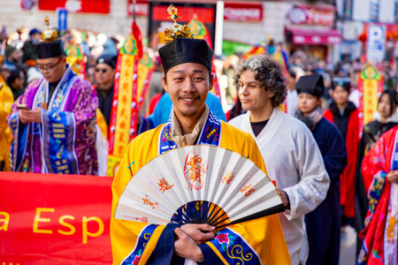 Chinese citizens celebrating Lunar New Year in the streets during public festivities marking the Year of the Horse in 2026. Cultural tradition and community event.のeditorial素材