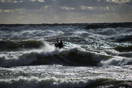 Kiting during the storm in Baltic sea at sports eventの写真素材