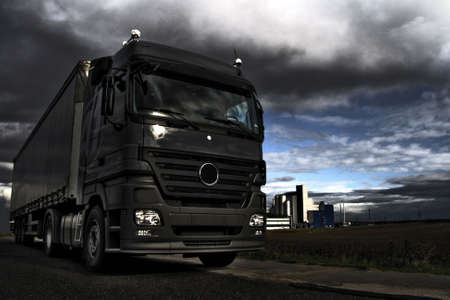 Truck in industrial landscape on dramatic HDR backgraoundの写真素材
