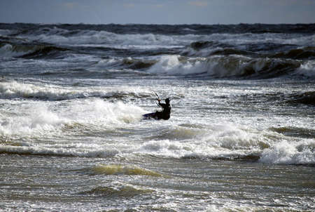 Kitboarder in stormy sea during sport eventの写真素材