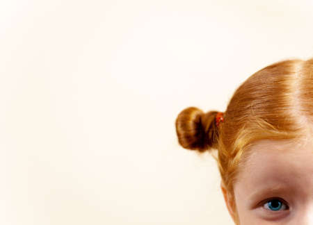 Girl redhead elegant with glasses against slightly purple background showing various facial expresions and copy paste spaceの写真素材