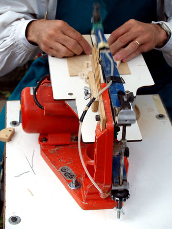 Close up with a wood cutting machine