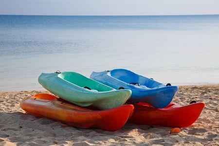 Recreational plastic boats on the beachの写真素材