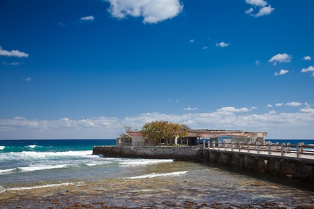Abandoned and destroyed by weather pier on caribbean sea cost in Cubaの写真素材