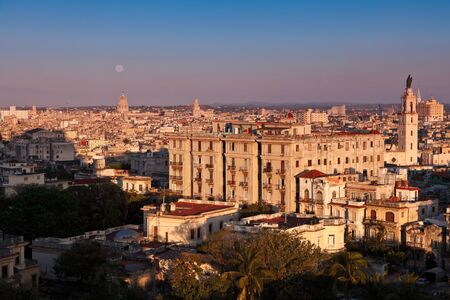 Full moon rising at sunset over Havana city, Cubaの写真素材