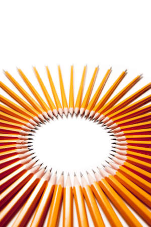 all pencils pointing to the center of the circleの写真素材