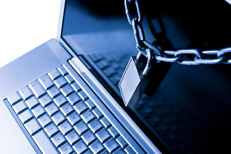 laptop secured with chain and padlock