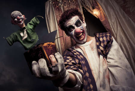 scary clown holding a Jack-in-the-box toyの写真素材