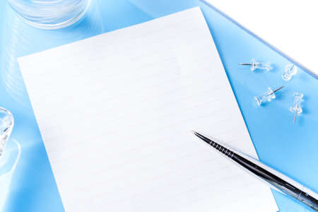 Top view on office blue desk with objects の写真素材