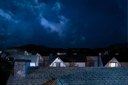 roof of house at night ideal for putting your image of something on topの写真素材