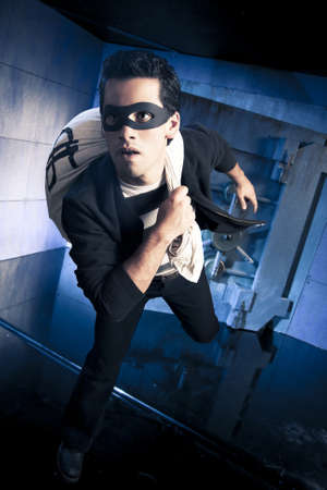 thief running out of a bank vault, low-key photoの写真素材