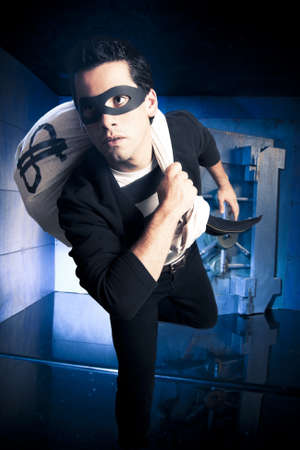 thief running out of a bank vault, low-key photoの写真素材