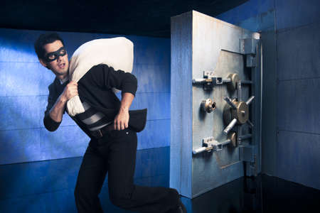 thief running out of a bank vault, low-key photoの写真素材