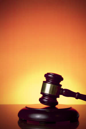 judge gavel on orange backgroundの写真素材