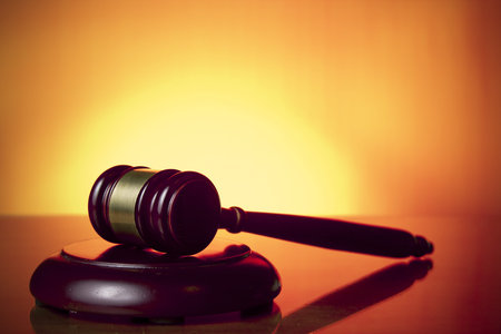 judge gavel on orange background