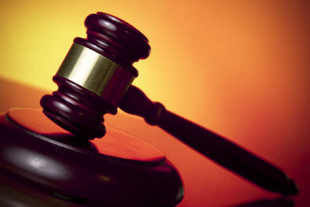 judge gavel on orange backgroundの写真素材