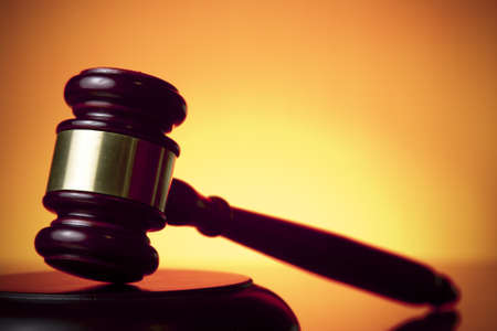 judge gavel on orange backgroundの写真素材