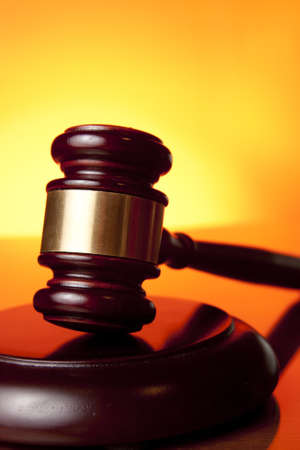 judge gavel on orange backgroundの写真素材