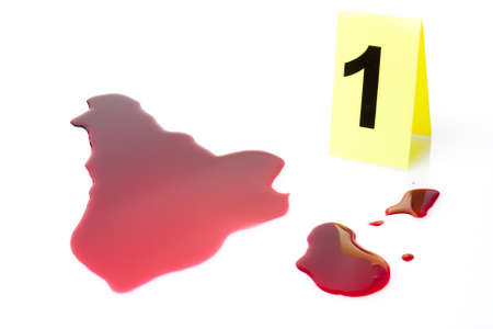 evidence marker with blood splatter isolated on whiteの写真素材