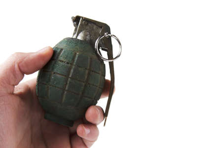 hand holding a grenade isolated on whiteの写真素材