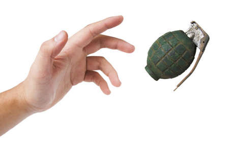 hand throwing a grenade isolated on whiteの写真素材