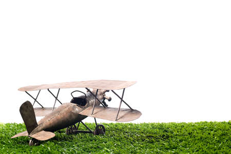 vintage metal airplane on a white backgroundの写真素材