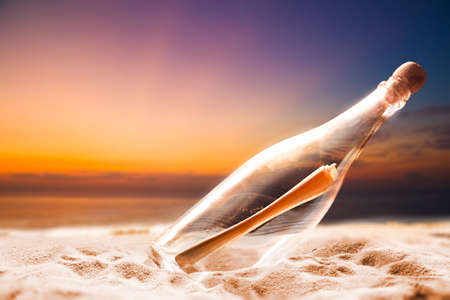 Message in a bottle on a shoreの写真素材