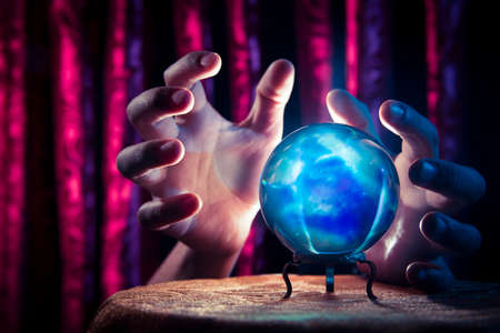Magic crystal ball on a tableの写真素材