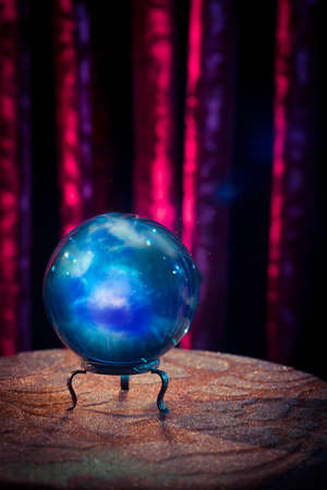 Magic crystal ball on a tableの写真素材
